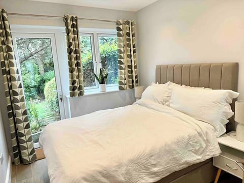 Bedroom with mature garden view