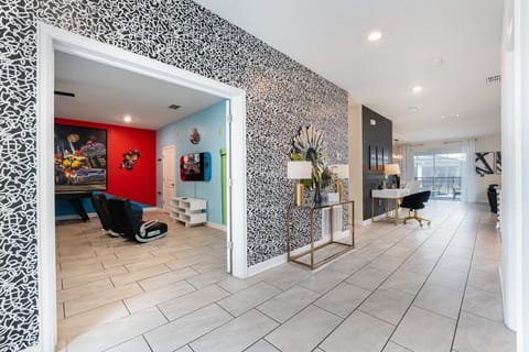 Dive into fun in this vibrant game room, complete with immersive decor and cozy seating for endless entertainment.