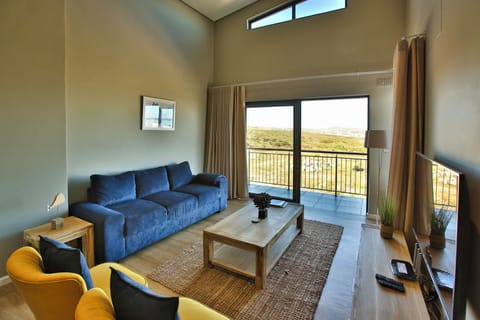 Elite Apartment | Living area | 42-inch flat-screen TV with satellite channels