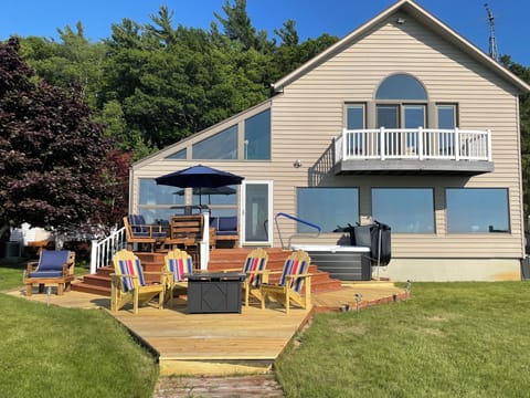 Soak in sunsets over Lake Michigan! Our deck furniture seats 11. Hot tub seats 6
