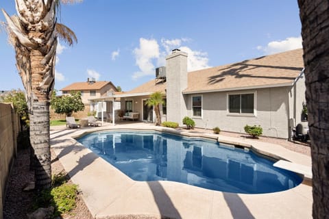 Large private backyard with sparkling pool