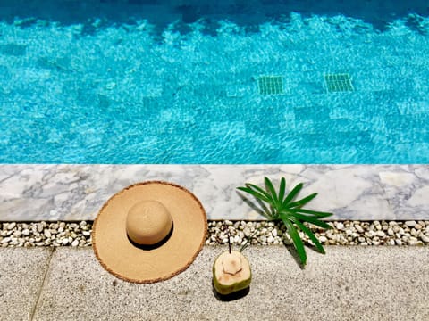 Outdoor pool, a waterfall pool, sun loungers