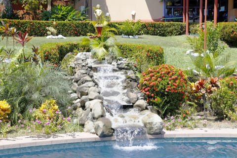 Outdoor pool, open 6:00 AM to 9:00 PM, pool umbrellas, sun loungers