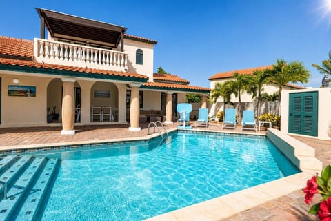 Refreshing outdoor pool perfect for swimming, relaxing, sunbathing, and enjoying tropical weather year-round.