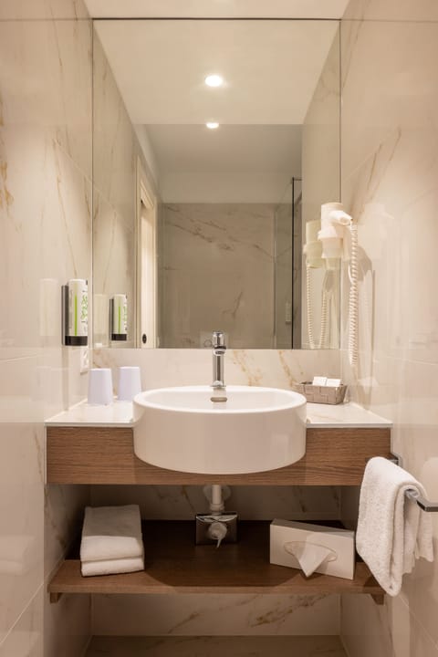 Eco-friendly toiletries, hair dryer, towels, soap