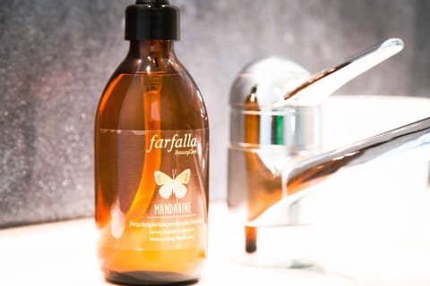 Eco-friendly toiletries, hair dryer, slippers, towels