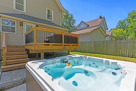 Private backyard hot tub just steps from the deck—perfect for relaxing after exploring Kansas City.