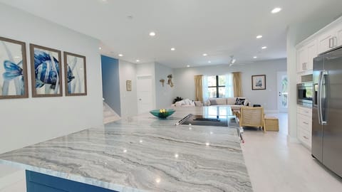 Open modern kitchen with 10ft island. 