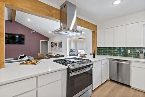 Kitchen oasis: experience culinary delights in a stylish space with appliances. 