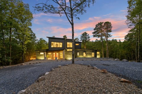 Exterior Escape: Modern beauty nestled among trees; enjoy stunning sunsets from your front porch!