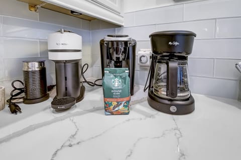 Coffee Bar - This house is equipped with a Keurig coffee maker, regular coffee pot, Nespresso machine and coffee ensuring you have access to your favorite brews with a selection of coffee pods available.