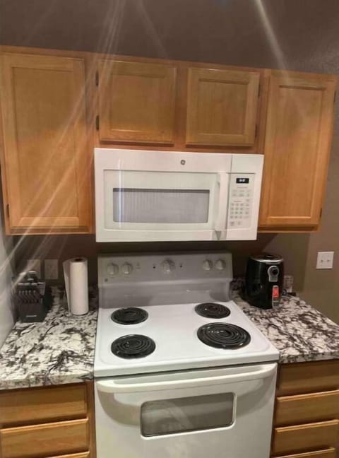 Stove, microwave, and kitchen essentials included.