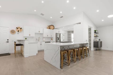 Completely redone kitchen, two kitchen bars with setting for 8. 