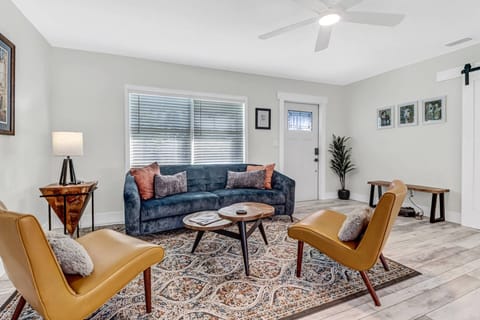 Artist's choices are in the living room in artful abode, close to downtown.