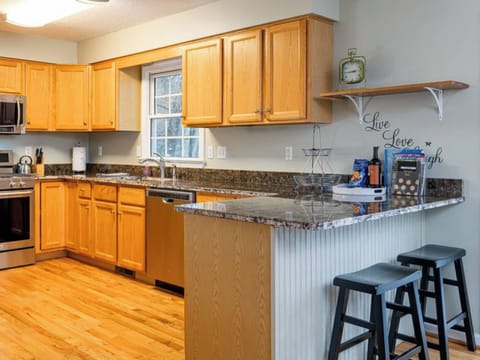 Stylish and functional kitchen with ample counter space and bar stools.