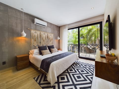 Indulge in the comfort of our beautifully appointed room, where a king-size bed, Smart TV, and private balcony create an ideal retreat for relaxation.