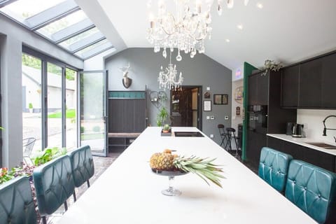 Looking down the kitchen with the main bathroom at the end