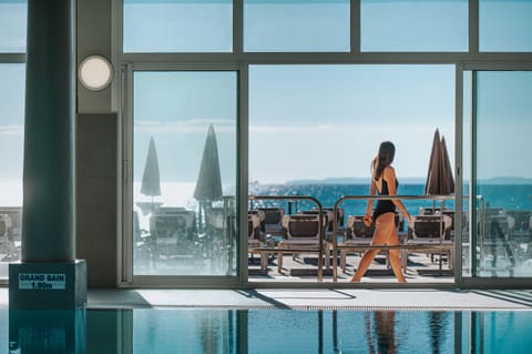 Indoor pool, open 8:30 AM to 7:00 PM, pool umbrellas, sun loungers