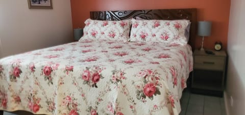 King-size bed in a bedroom with a door