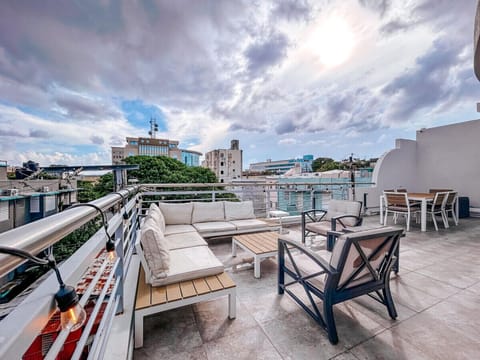 Relax on a spacious rooftop terrace offering breathtaking views and an intimate setting for outdoor enjoyment.