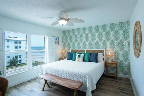 Escape to the master bedroom with beautiful views.