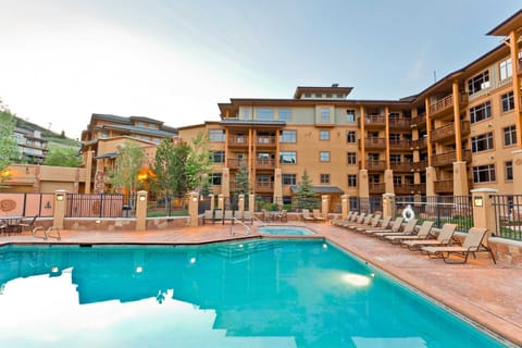 Outdoor heated pool with hot tub