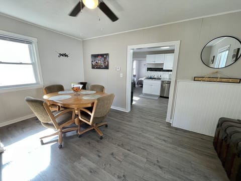 Dining room; table for 6 with 4 dining chairs & 2 folding chairs in the closet