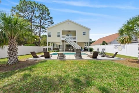 Welcome to Latitude Adjustment - a luxury beach house with a sparkling heated pool!