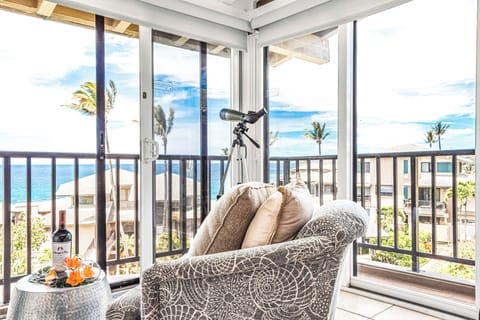 The living room opens up to the outside for open-air living with indoor space.