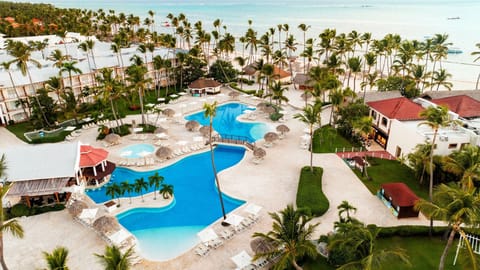 On the beach, white sand, sun loungers, beach towels