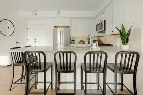 Kitchen has 6 bar stools