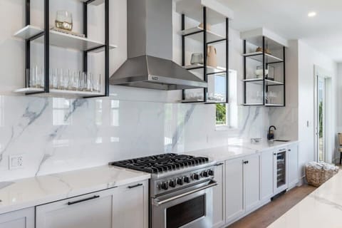 Gourmet kitchen equip with Keurig coffee machine, lots of cookware, and enough dishes and utensils for everyone