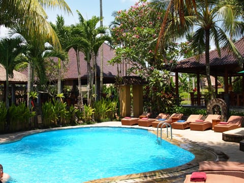 Outdoor pool, open 7:00 AM to 10:00 PM, sun loungers
