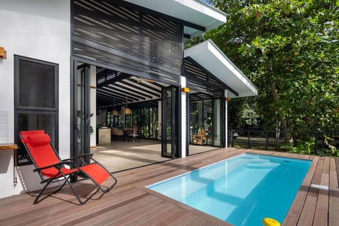 Modern home with private pool and open living space surrounded by tropical nature in Puerto Viejo.