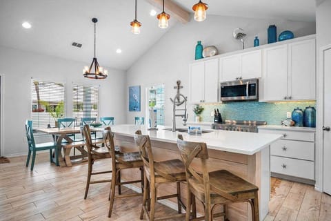 Gather 'round our spacious dining table with ample seating for all your friends and family to enjoy.