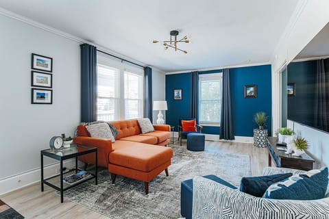 Spacious living room with couch and smart TV