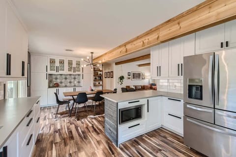 Charming kitchen with rustic touches and updated appliances for a perfect blend of old and new.