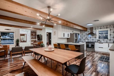 Stylish dining table with comfortable chairs, ideal for enjoying meals or playing board games.