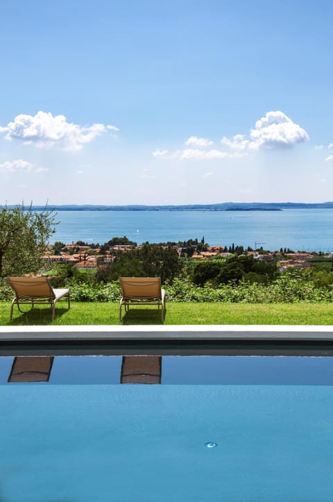 Outdoor pool, a rooftop pool, pool umbrellas, sun loungers
