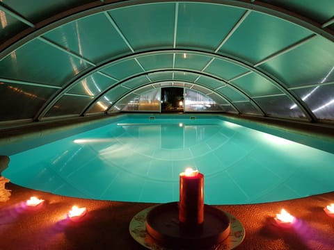 Indoor pool, outdoor pool, open 10:00 AM to 8:00 PM, pool umbrellas