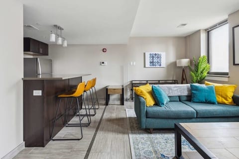 Mini bar and stylish teal sofa 