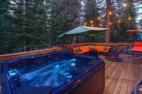Enjoy the expansive back deck with outdoor lounge furniture, gas grill and private hot tub!