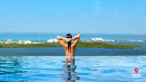 Outdoor pool, open 7:00 AM to 11:00 PM, pool umbrellas, sun loungers