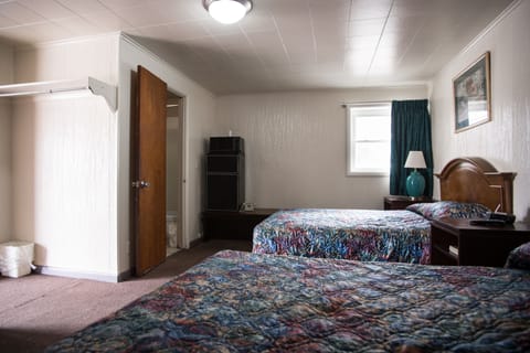 Room, 2 Queen Beds | Iron/ironing board, free WiFi, bed sheets