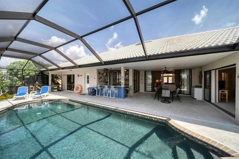 Pool, bar, and outdoor dining