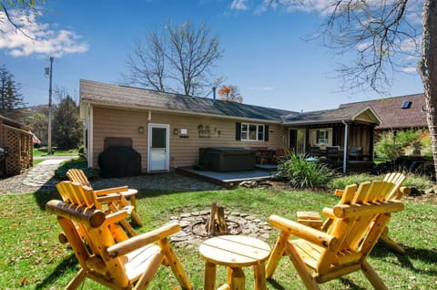 Private backyard with hot tub, fire pit, and outdoor gathering space