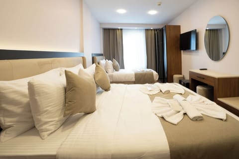 Family Triple Room, City View | Premium bedding, minibar, in-room safe, desk