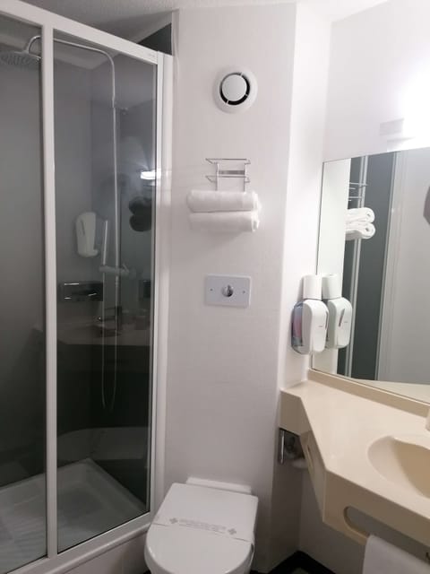 Shower, eco-friendly toiletries, hair dryer, towels