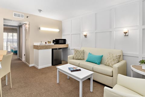 Suite, 1 King Bed | Living area | 50-inch Smart TV with cable channels, TV, streaming services