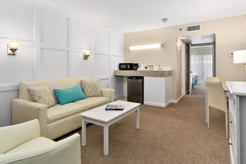 Suite, 2 Double Beds | Living room | 50-inch Smart TV with cable channels, TV, streaming services